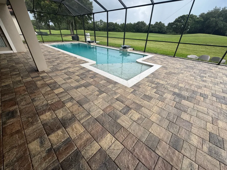 Sealed paver pool deck in Central Florida with deepened, enriched paver color