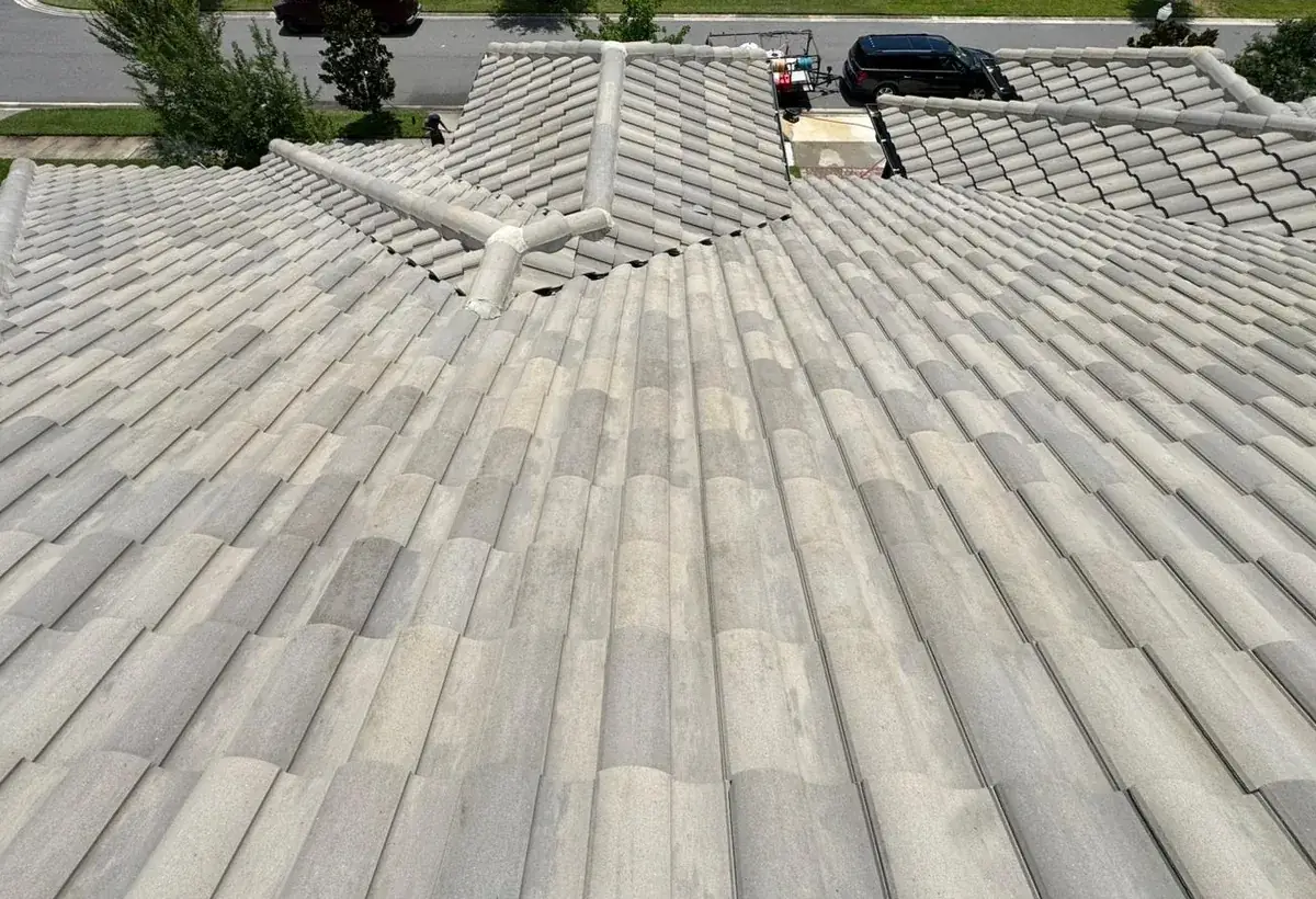 The same tile roof clean after low-pressure roof soft washing